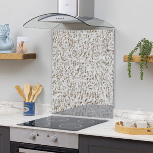 Elegant burnished toughened antique mirror used as a kitchen splashback, safe for installation behind gas hobs. Features a unique weathered finish with metallic tones